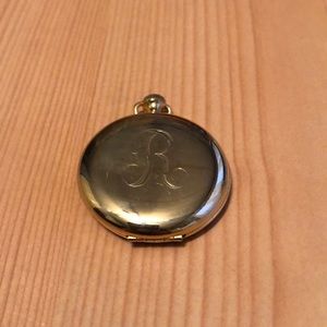 A locket necklace with chain.